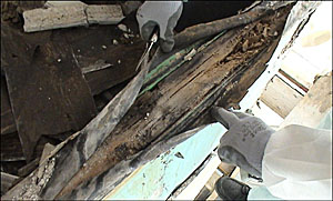 A photo of the damage caused by fixings penetrating the protective linings, into the top of a balustrade.