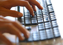 A person typing on a keyboard.